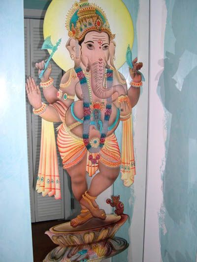 A painting of a deity with a crown on his head