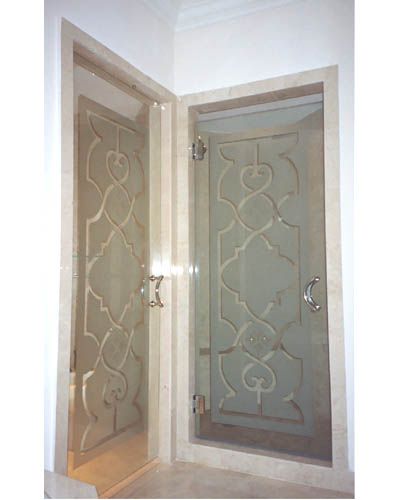 A pair of glass doors with a pattern on them.