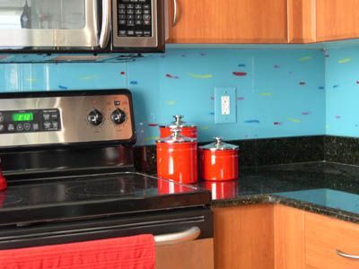 A kitchen with a stove top oven and a microwave