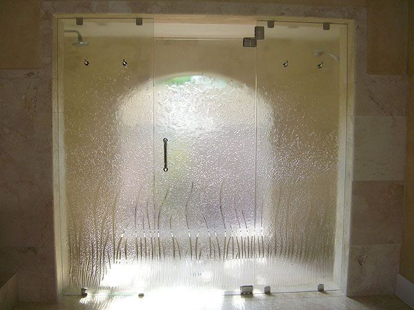 A glass door with a light shining through it.