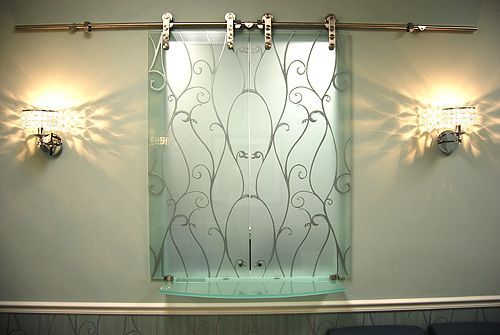 A sliding glass door with a floral design on it