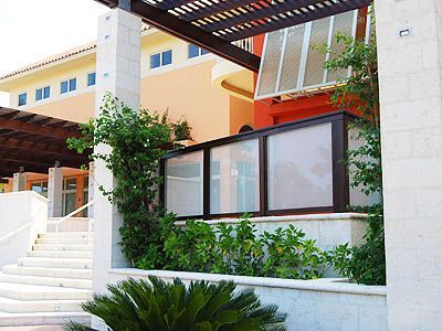 A building with stairs leading up to it and a fence surrounding it