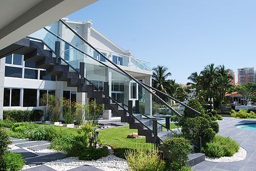 A large white house with stairs leading up to it