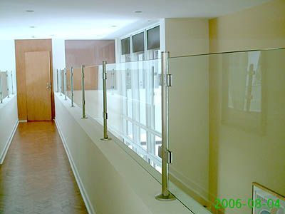 A photo of a hallway with a glass railing taken in 2006