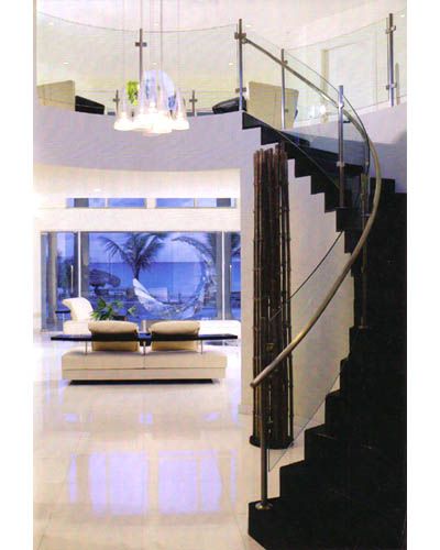 A living room with a staircase leading up to the second floor
