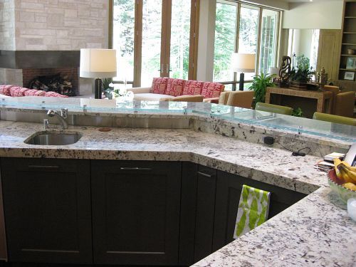 A kitchen with granite counter tops and a sink