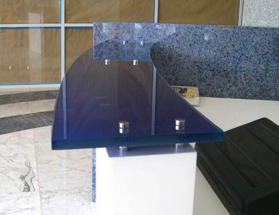 A blue acrylic table with a marble counter top
