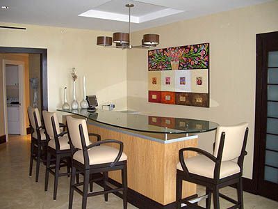 A dining room with a long table and chairs