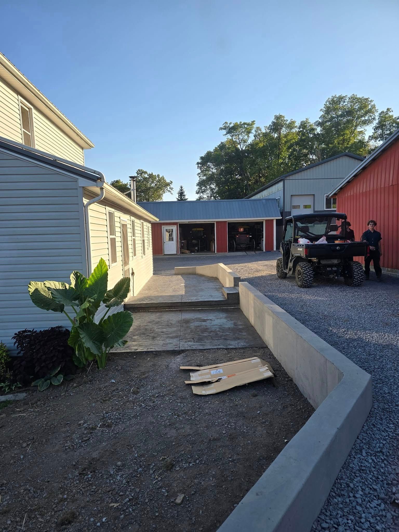 A jeep is parked in the driveway of a house.