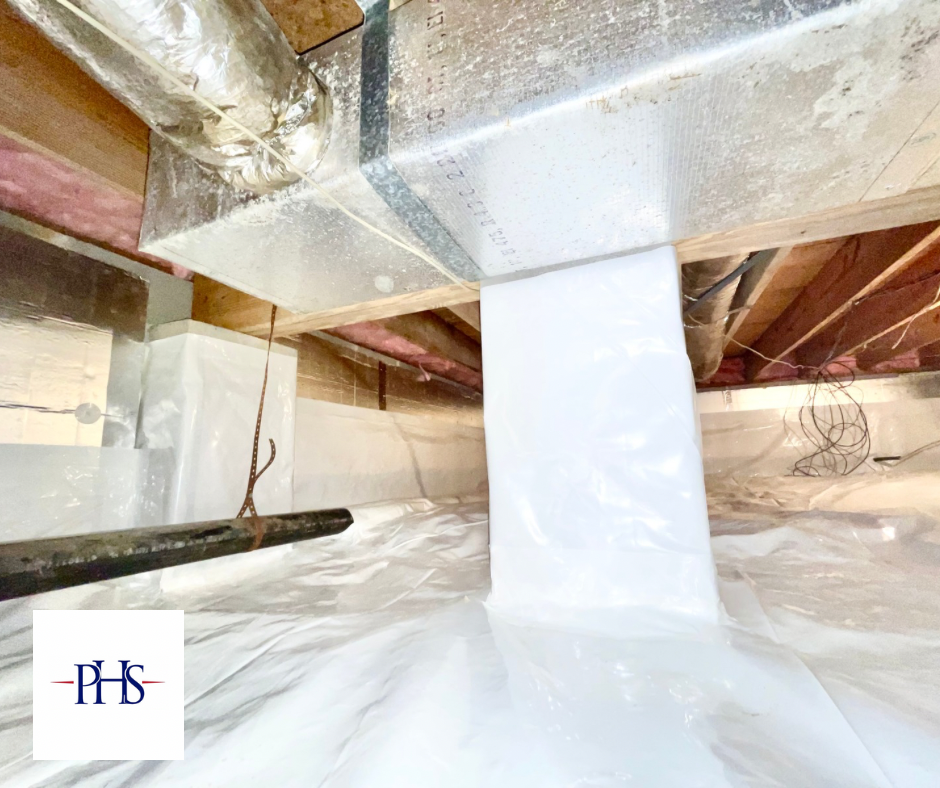 A picture of a crawl space covered in plastic.