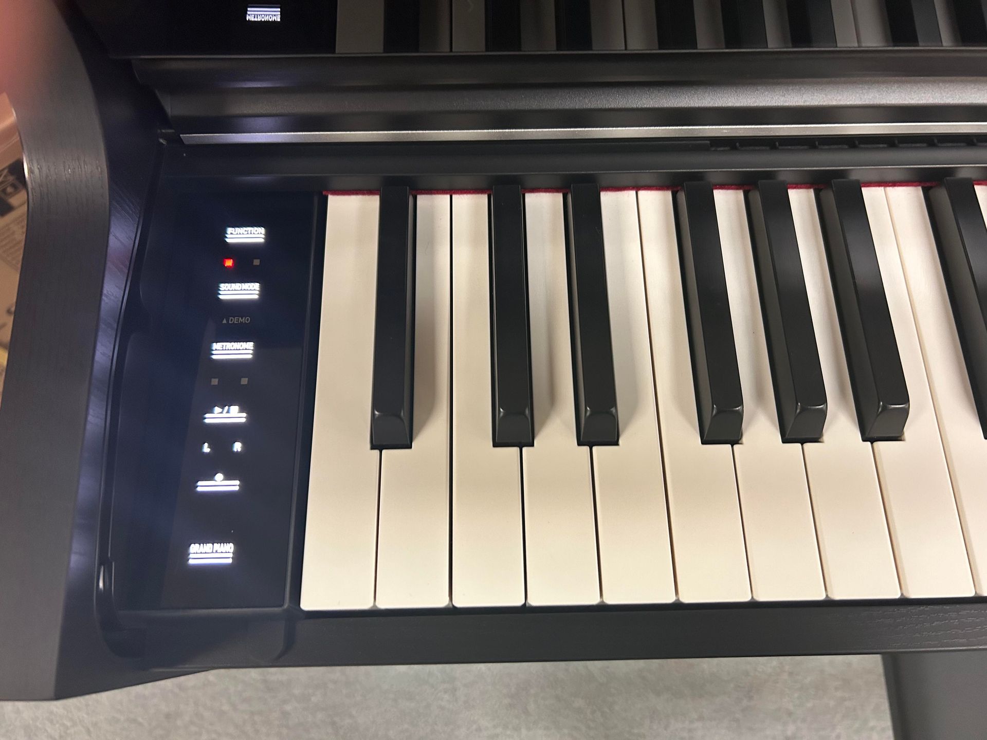 A close up of a piano keyboard with the number 1 on it