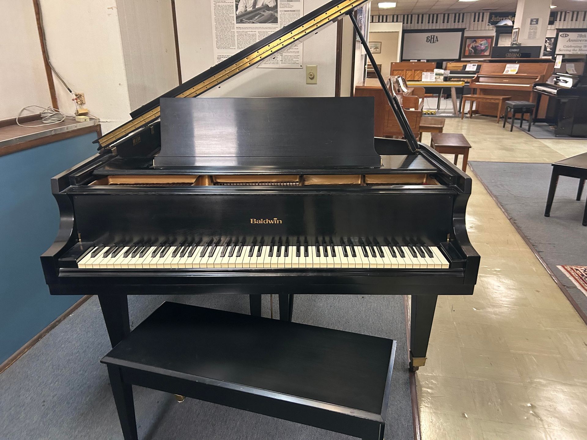 A front view image of a Baldwin Grand Piano 5'8