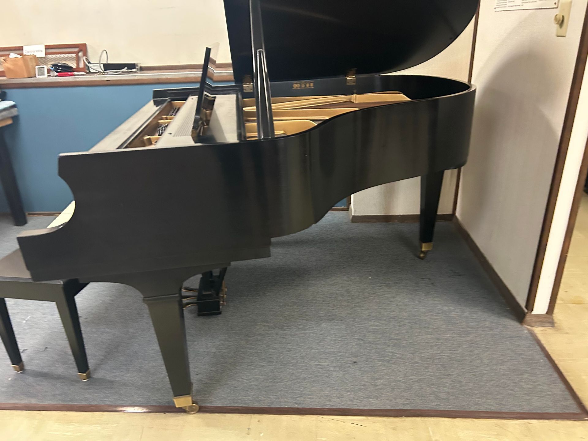 A side view image of a Baldwin Grand Piano 5'8