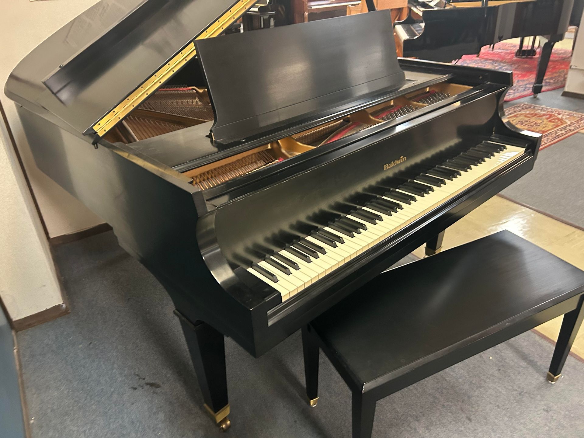 A front-side view image of a Baldwin Grand Piano 5'8