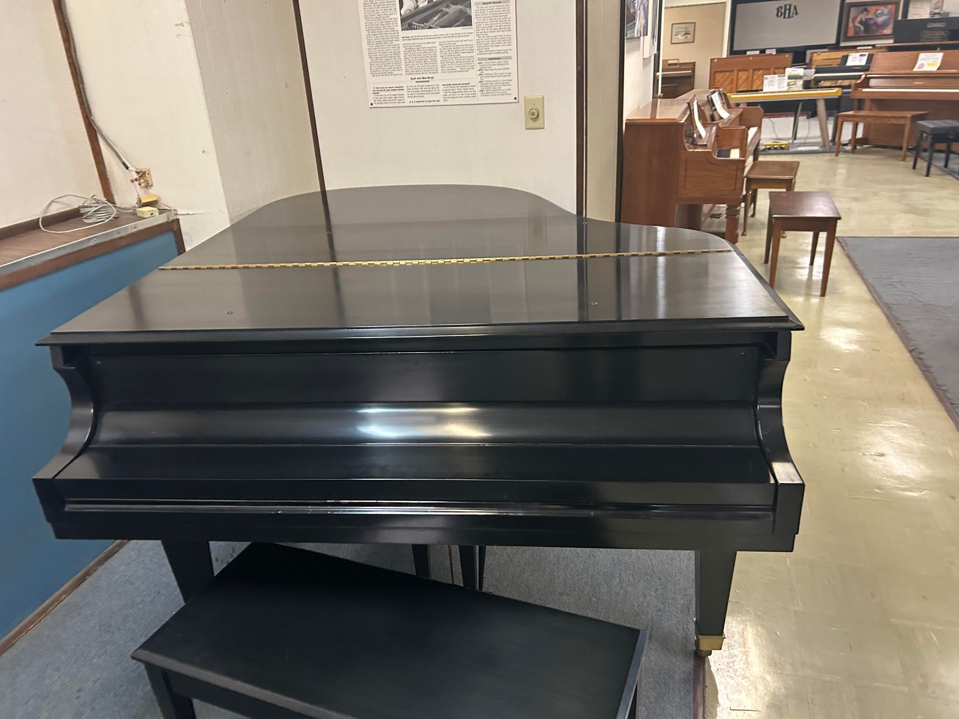 A front view image of a closed Baldwin Grand Piano 5'8