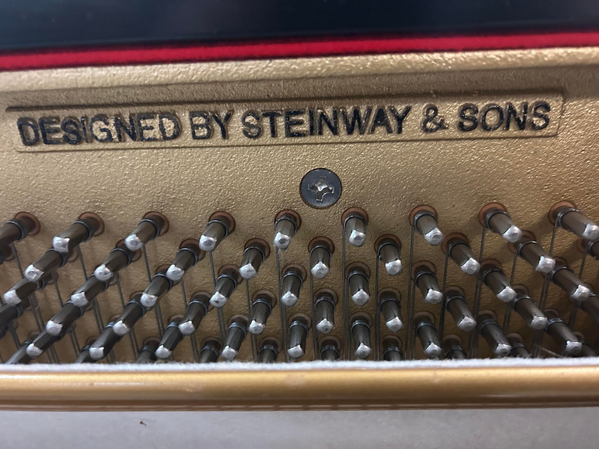 The inside of a piano is designed by steinway & sons.