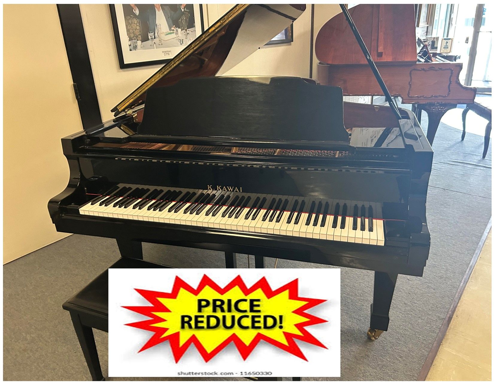 Black grand piano with bench,