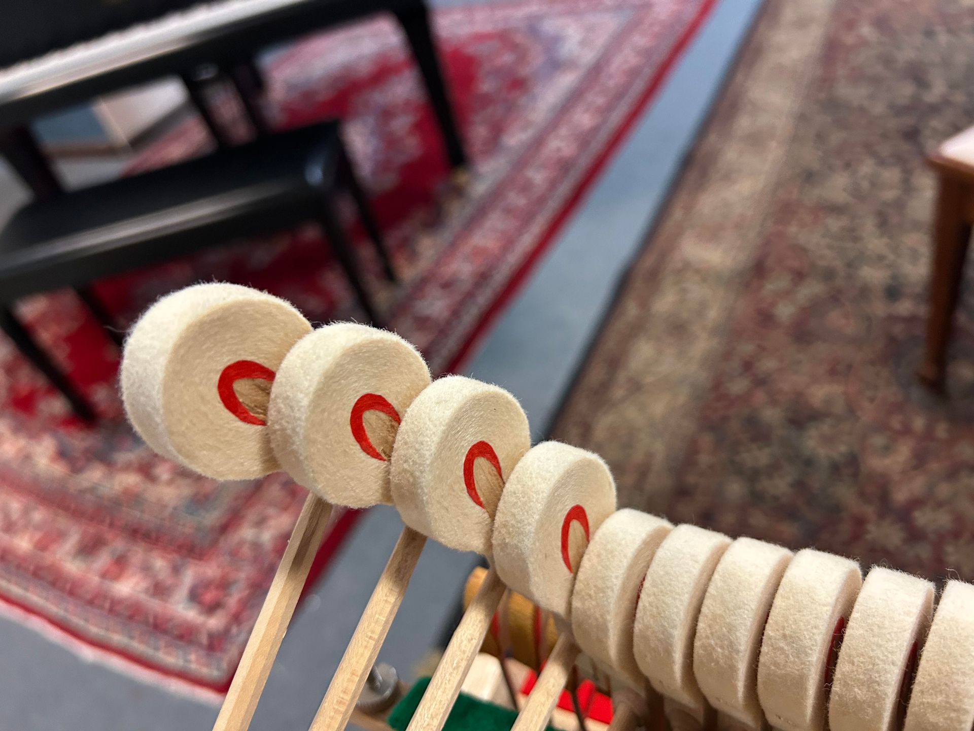 A close up of a piano keys with a red c on them