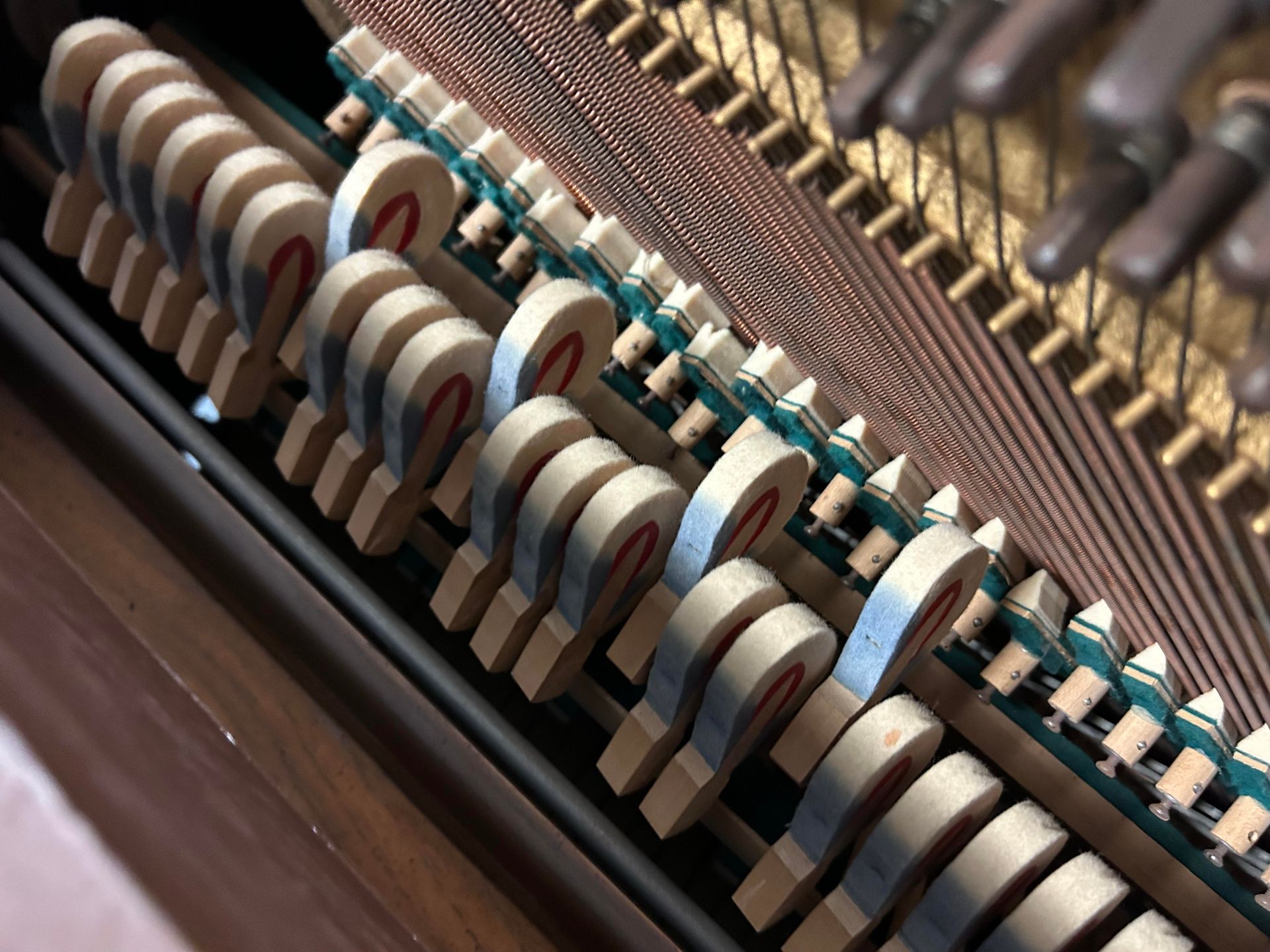 A close up of the inside of a piano