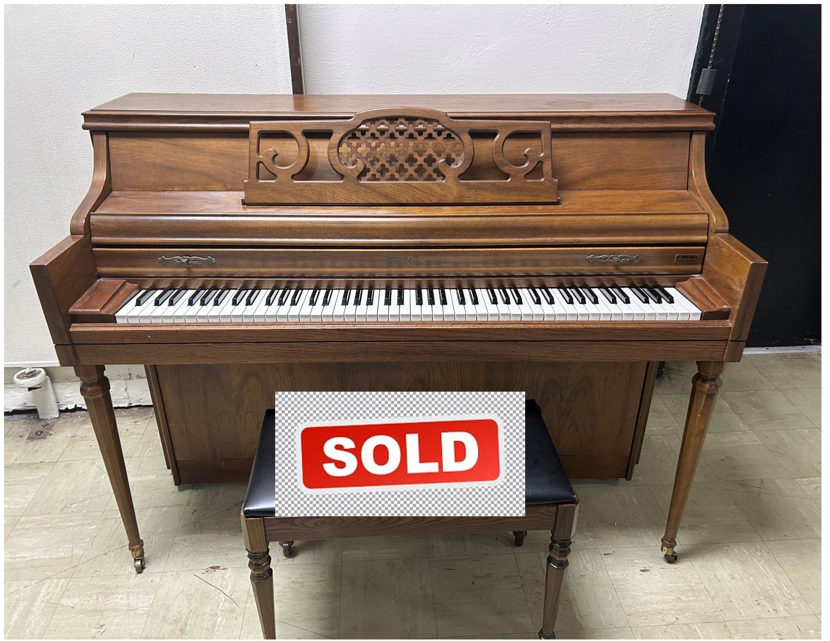 A piano with the words click fpr video below it