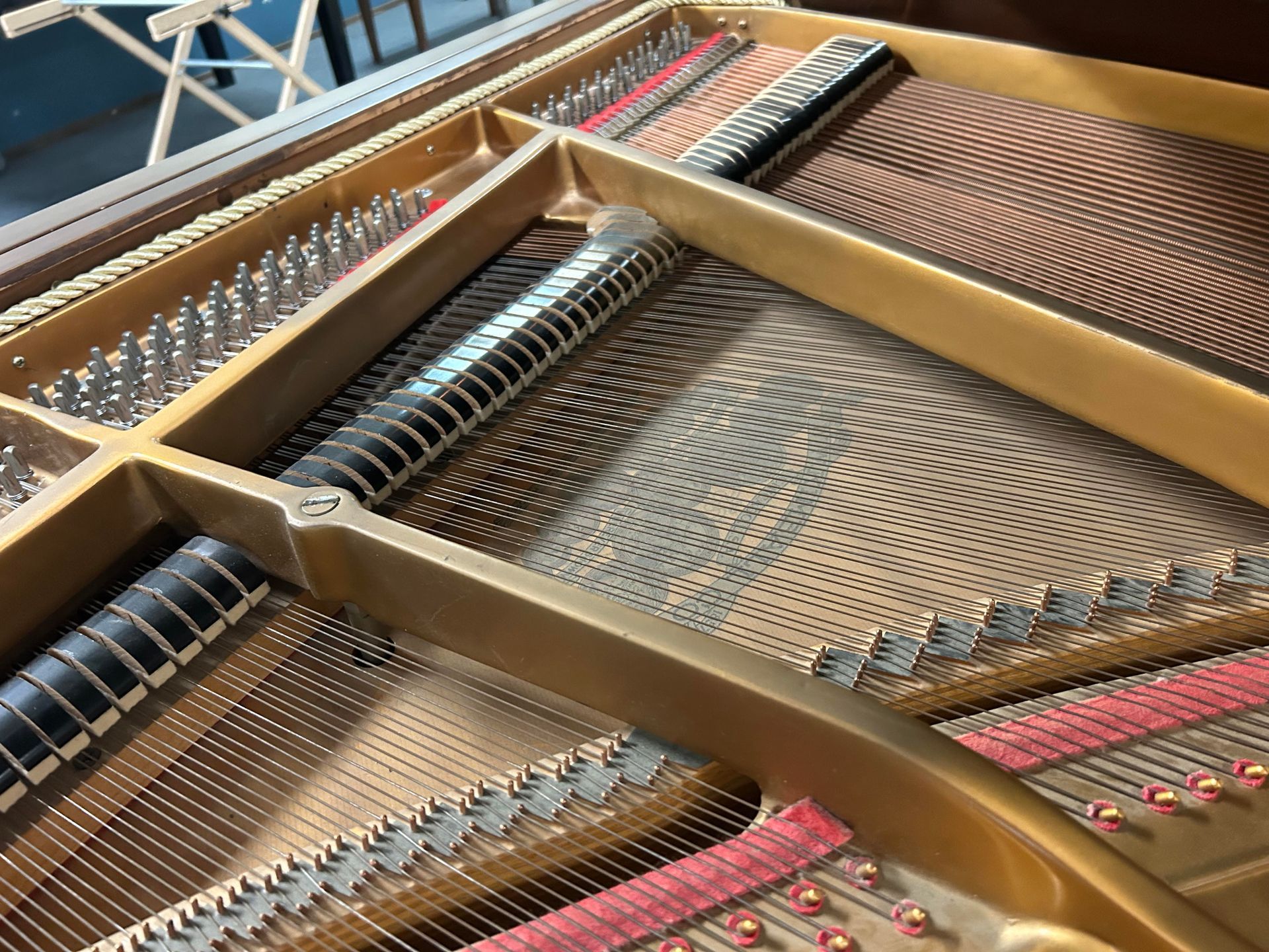 A close up of the inside of a grand piano.