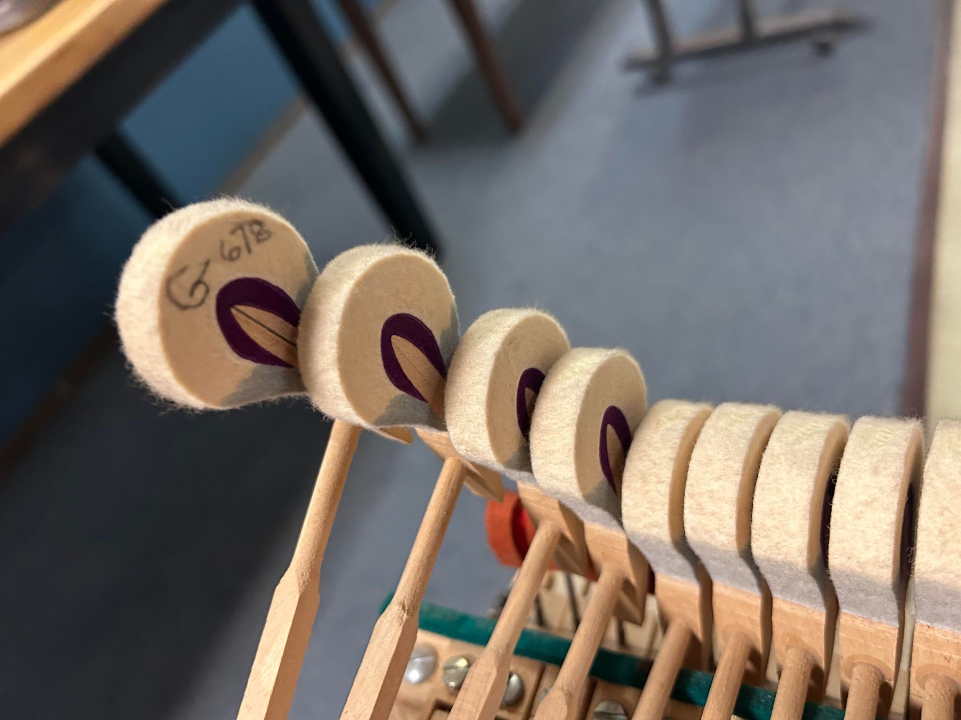 A close up of a piano key with the number g1673 on it