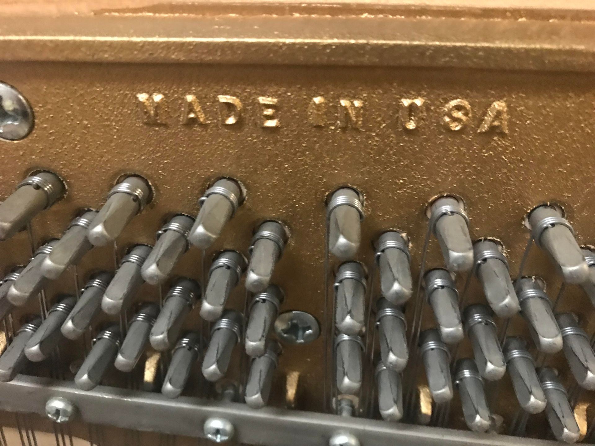 The inside of a piano made in the usa