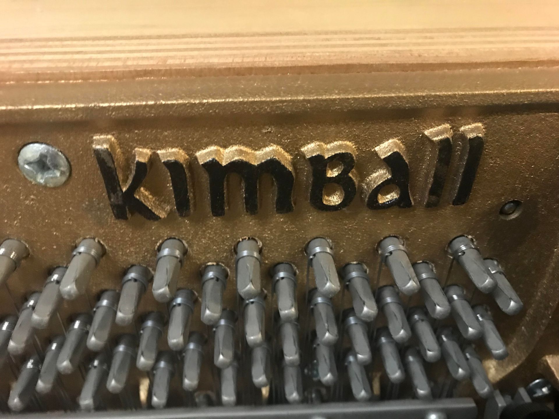 A close up of a piano with the word kimball on it