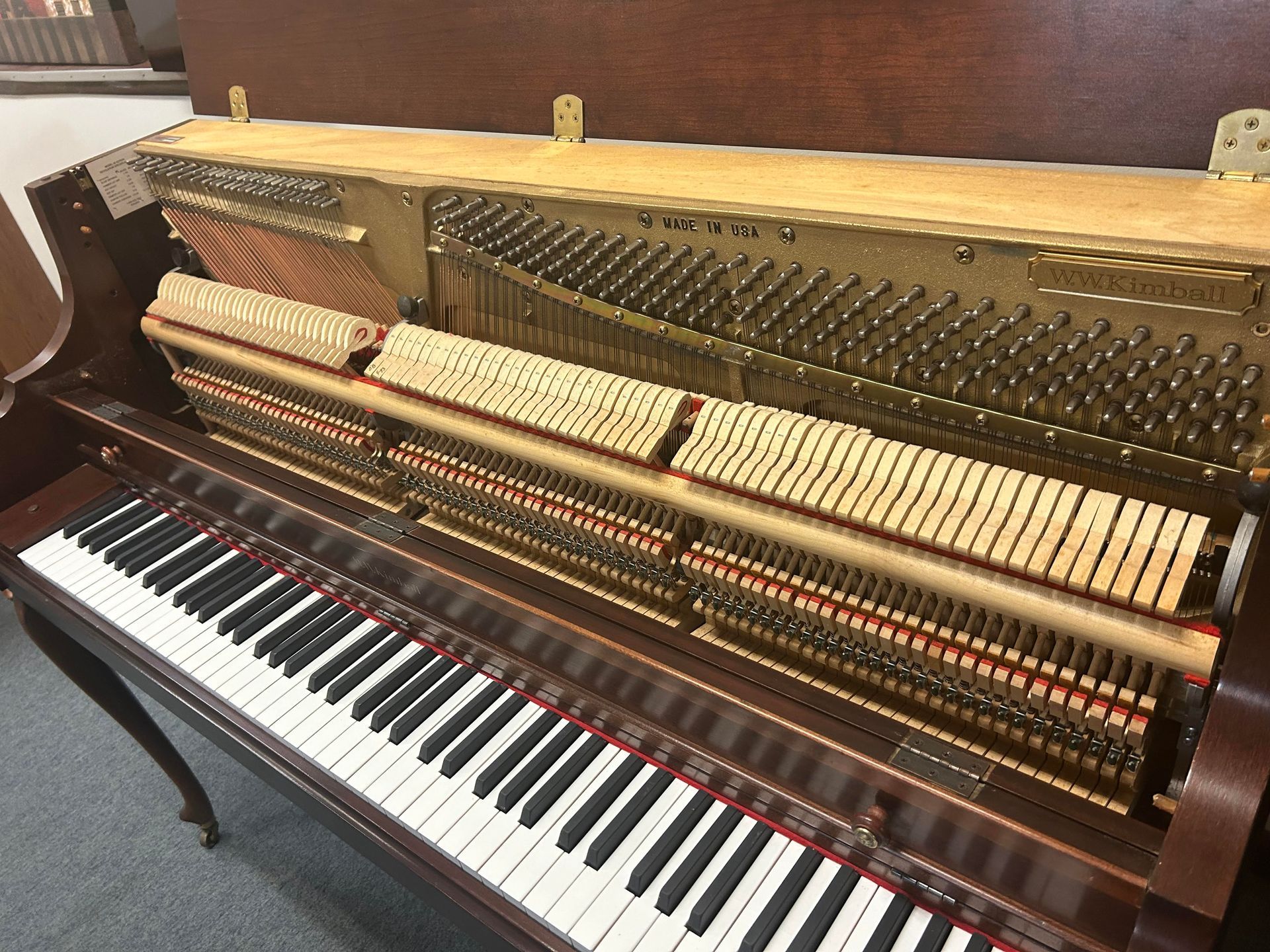 The inside of a piano with the keys visible