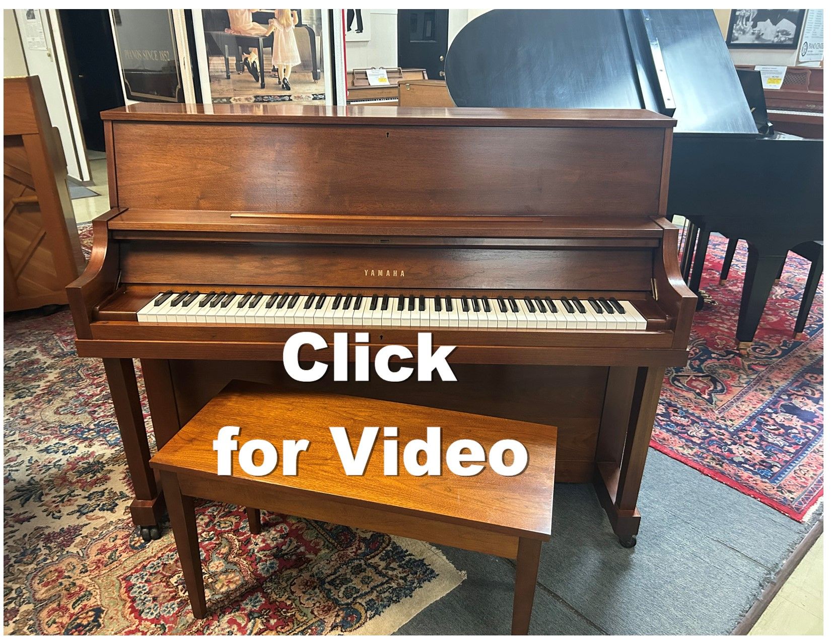 Upright wooden piano with bench. Text overlay reads