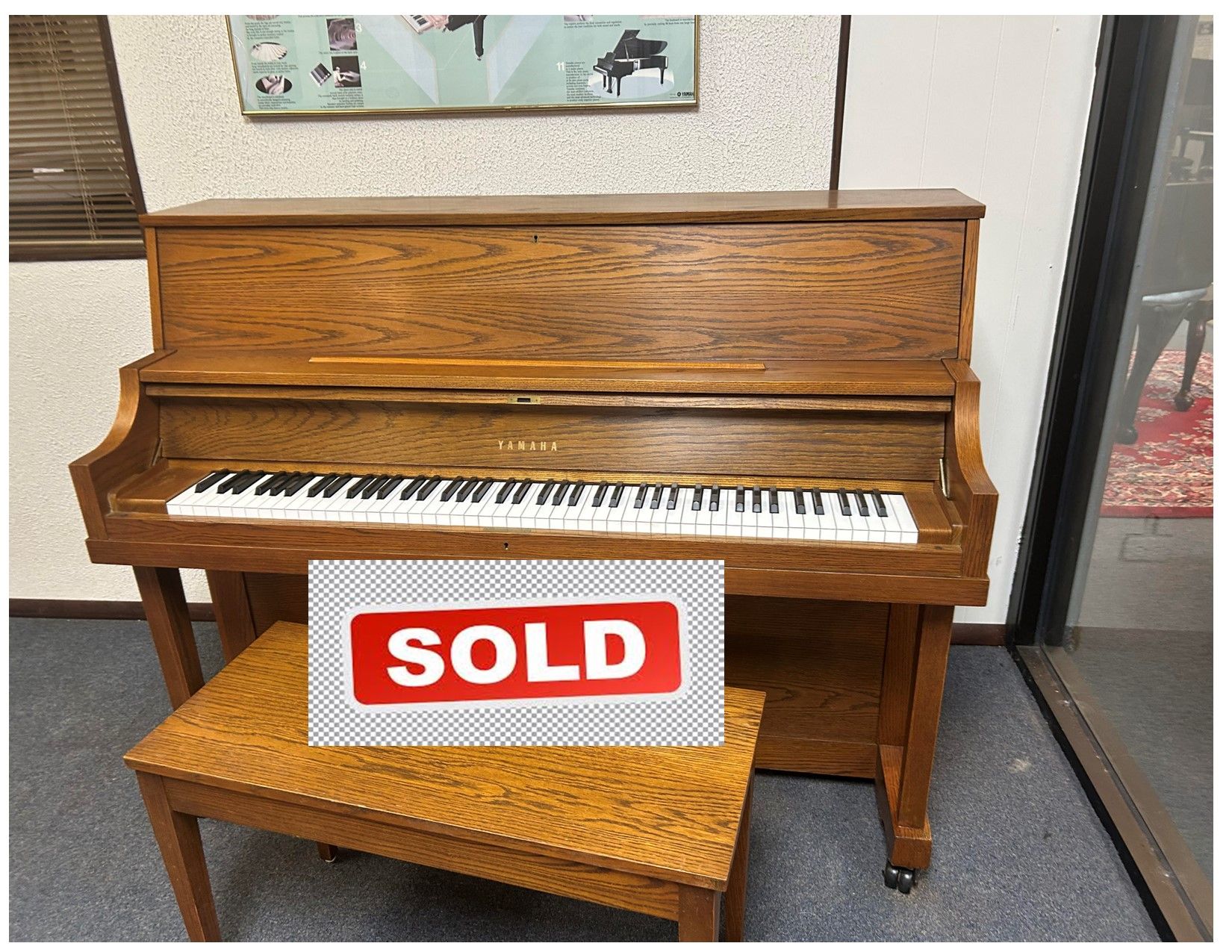 Wooden upright piano with bench;