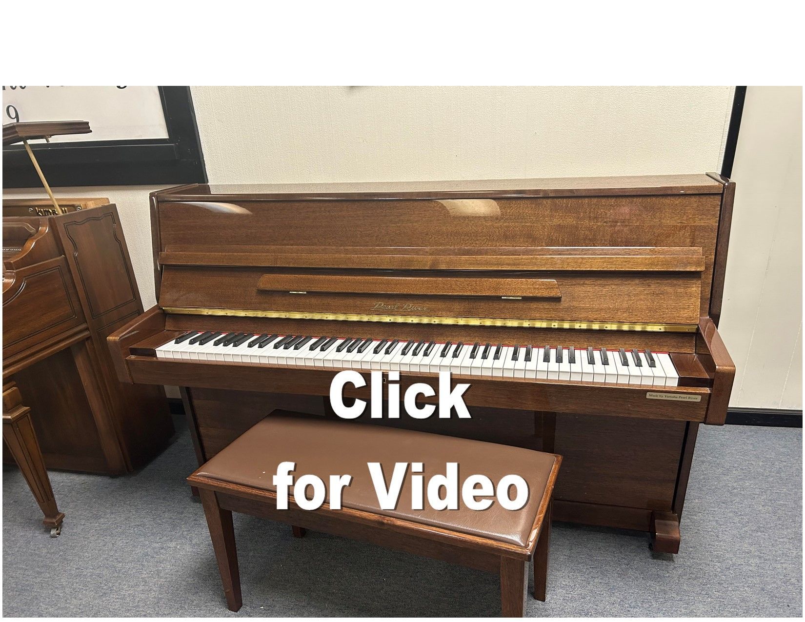 Upright wooden piano with bench; Click for Video text overlay.
