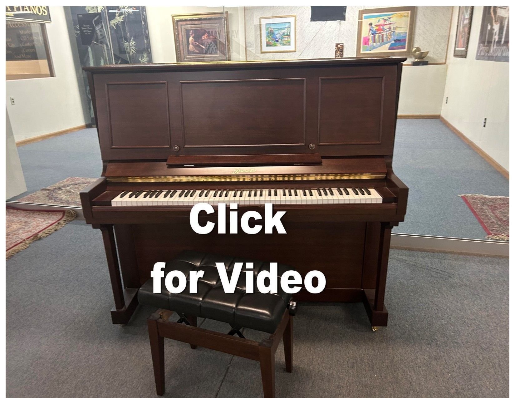 Upright piano with bench in room, 