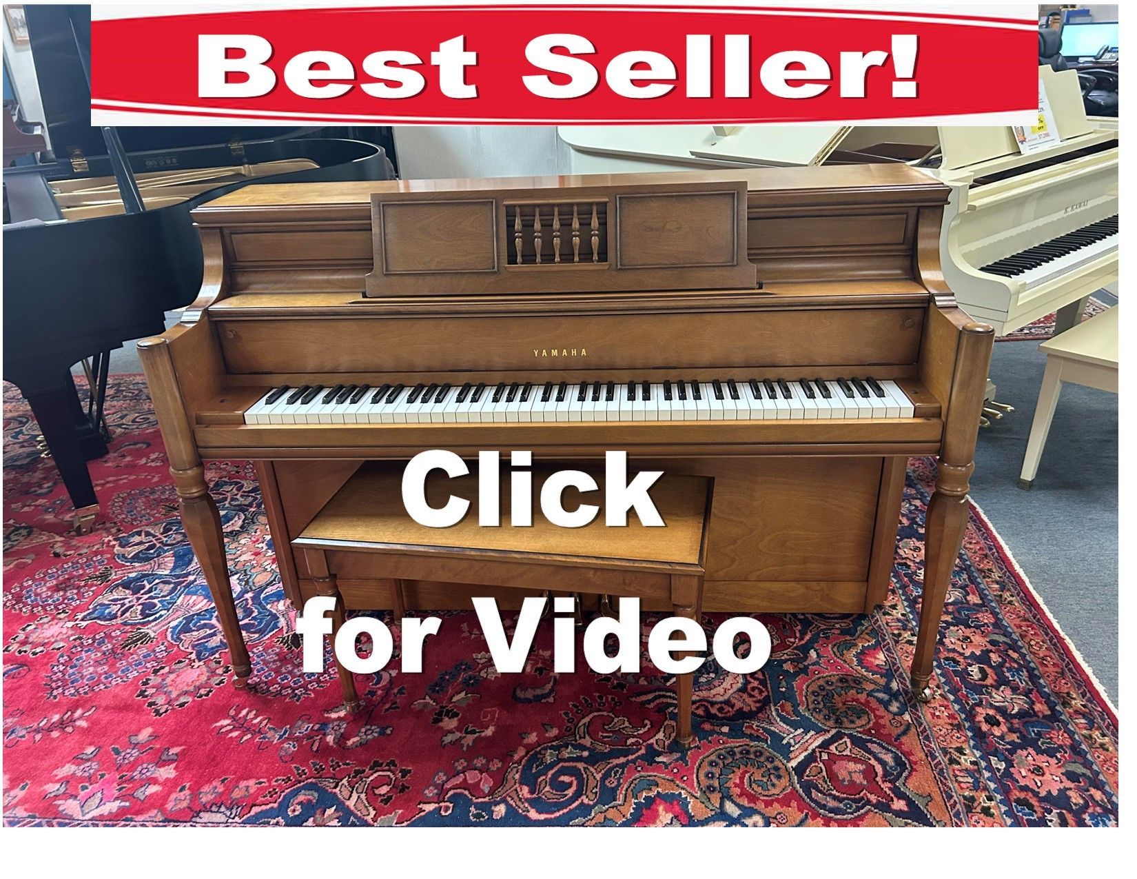 A piano is sitting on a rug with the words click for video below it.