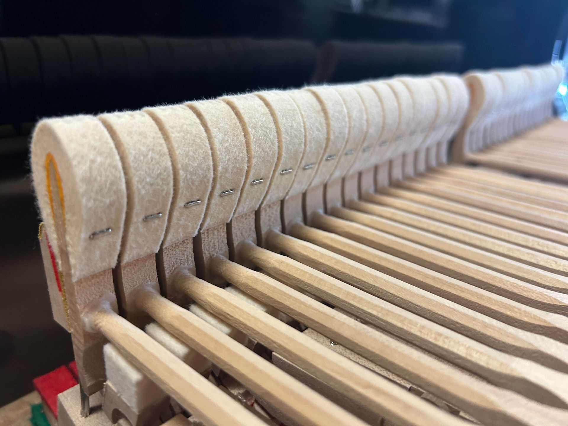 A close up of the inside of a piano.