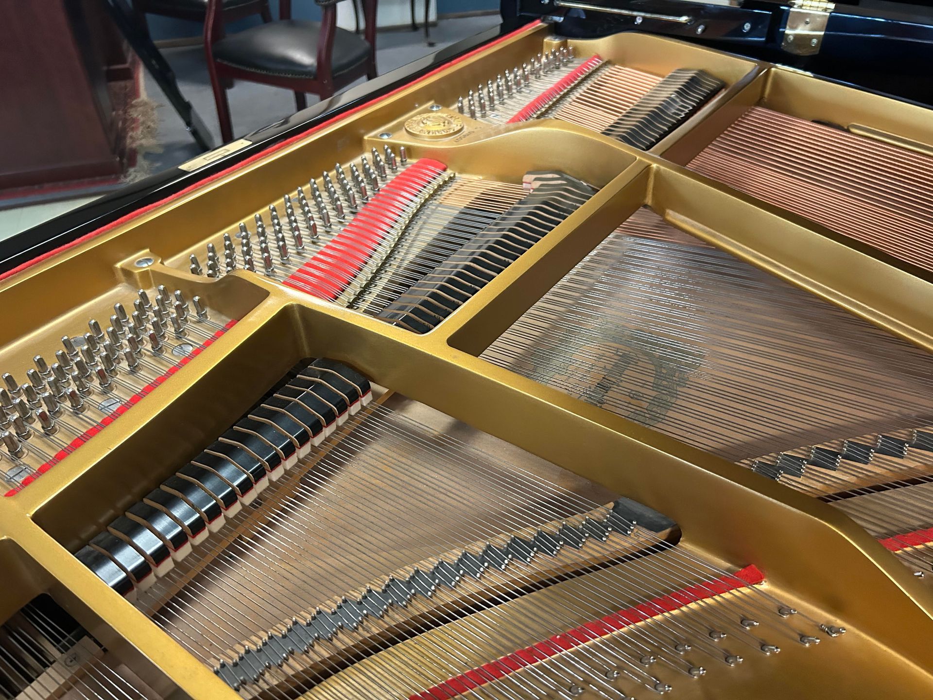 A close up of the inside of a grand piano.