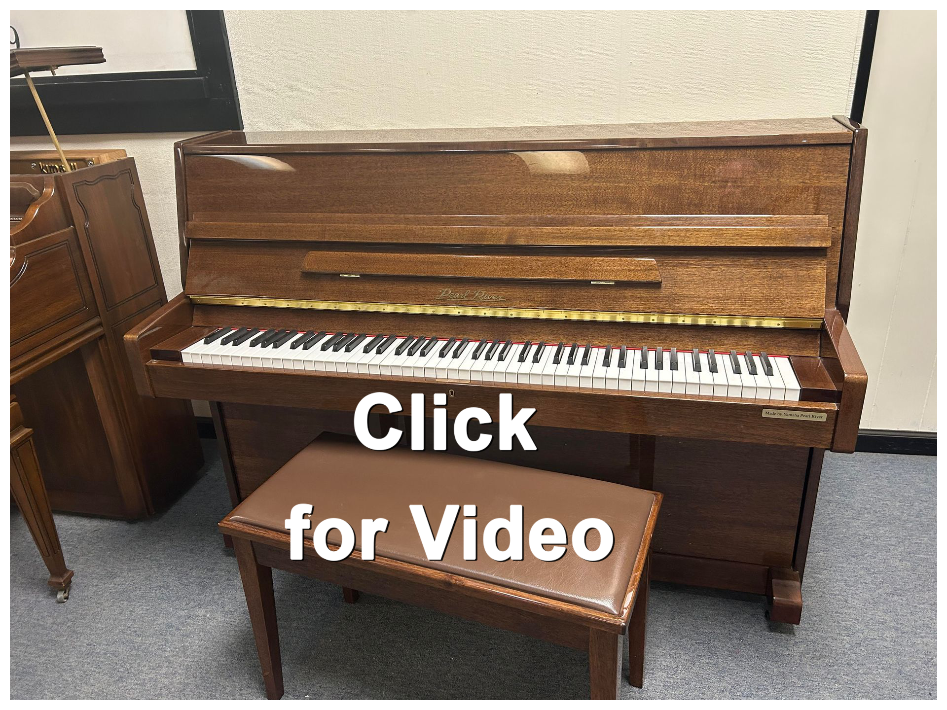Upright wooden piano with bench; Click for Video text overlay.