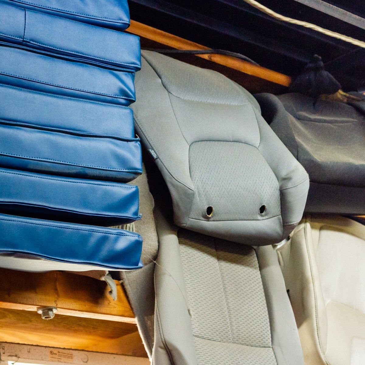 A bunch of seat covers are stacked on top of each other