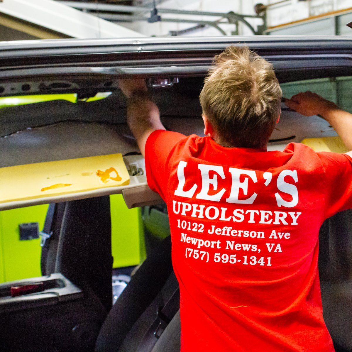 A man wearing a red lee 's upholstery shirt