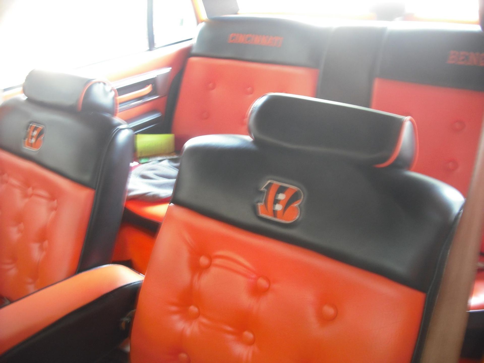 Orange and black seats with the letter b on them