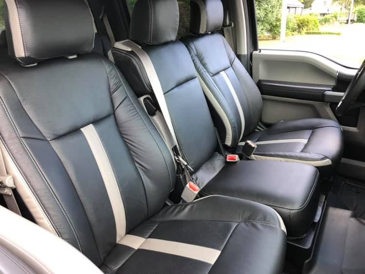 The back seats of a truck are black and white