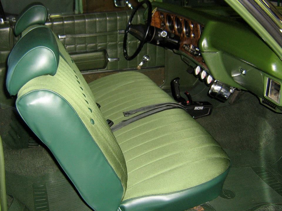 The interior of a green car with green seats