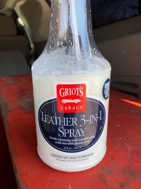 A bottle of griots garage leather 3 in 1 spray
