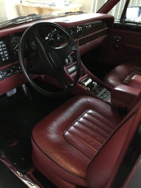 A car with red seats and a steering wheel