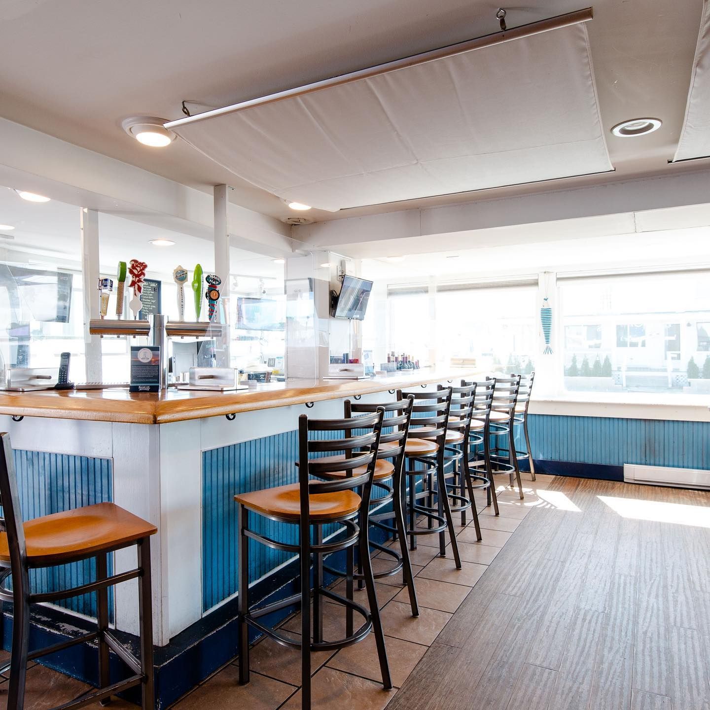 Bar with wooden bar stools and counter
