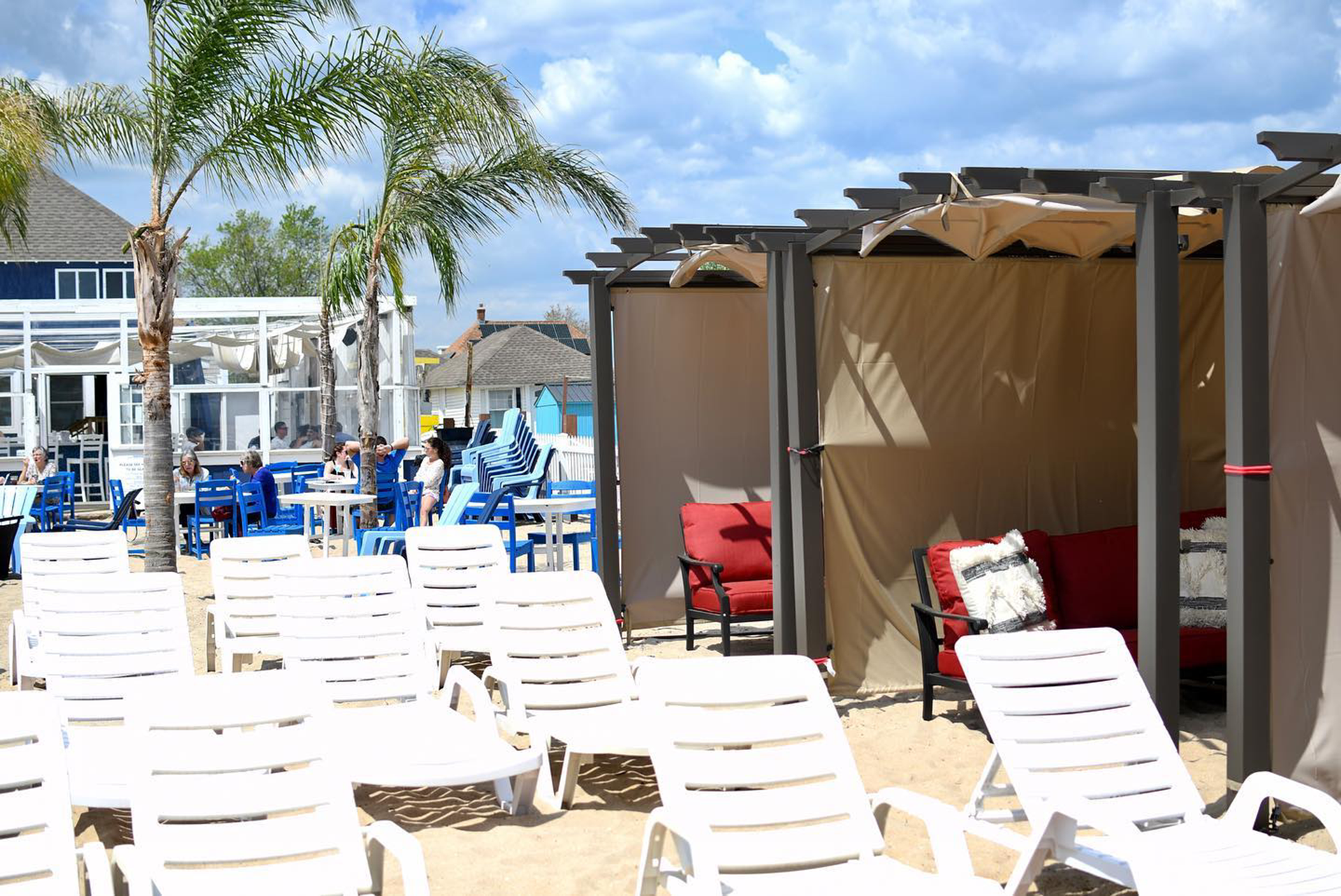 Beach scene with white lounge chairs