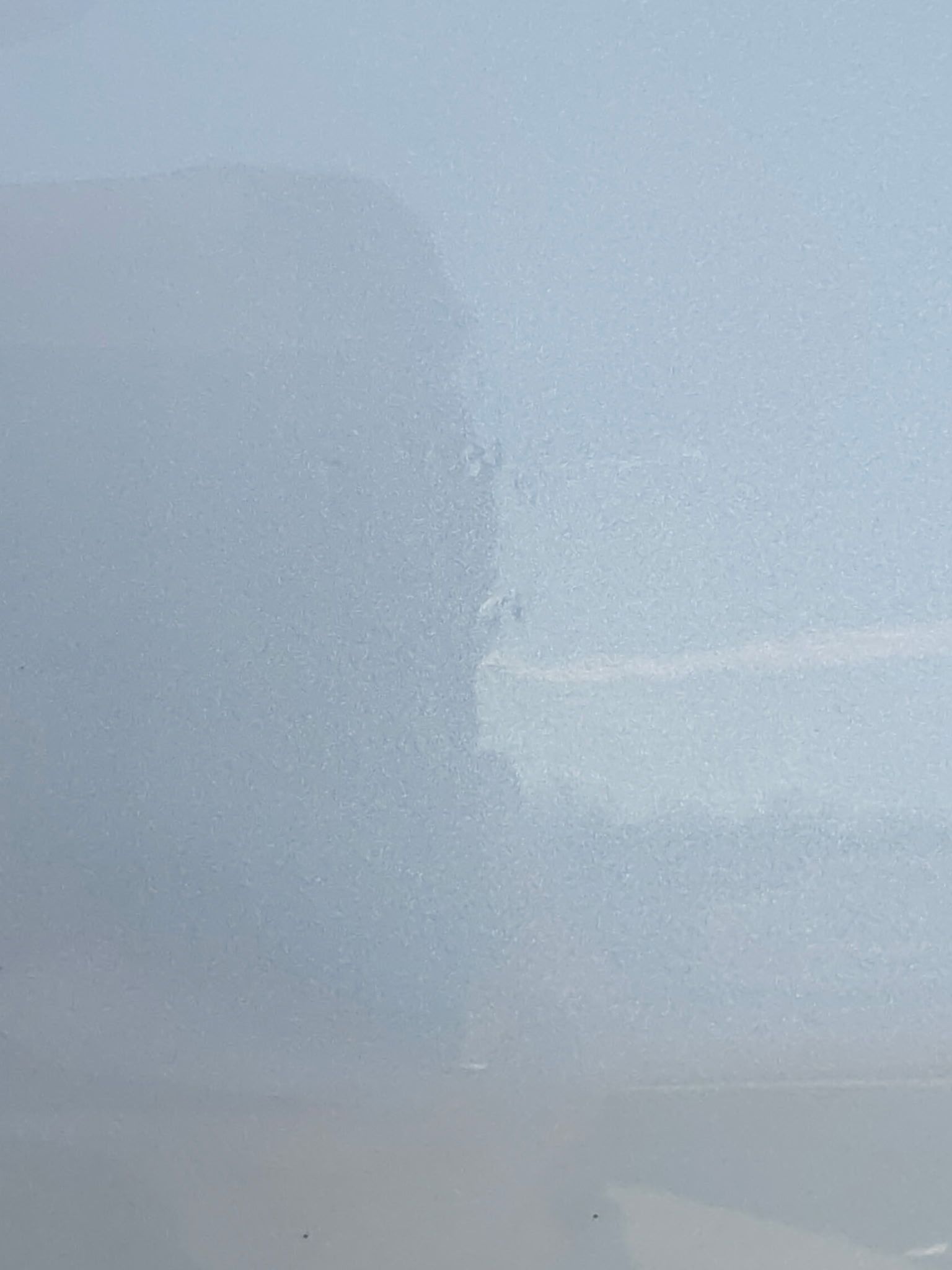 Light gray surface with a vertical seam and subtle texture.