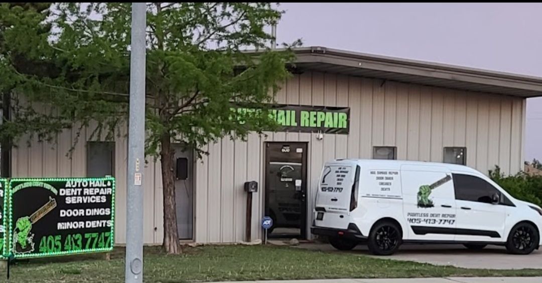 A white van parked outside a building with 