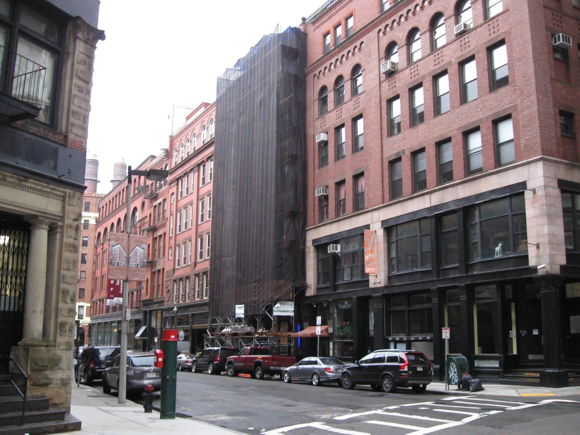 Building under construction with black safety net