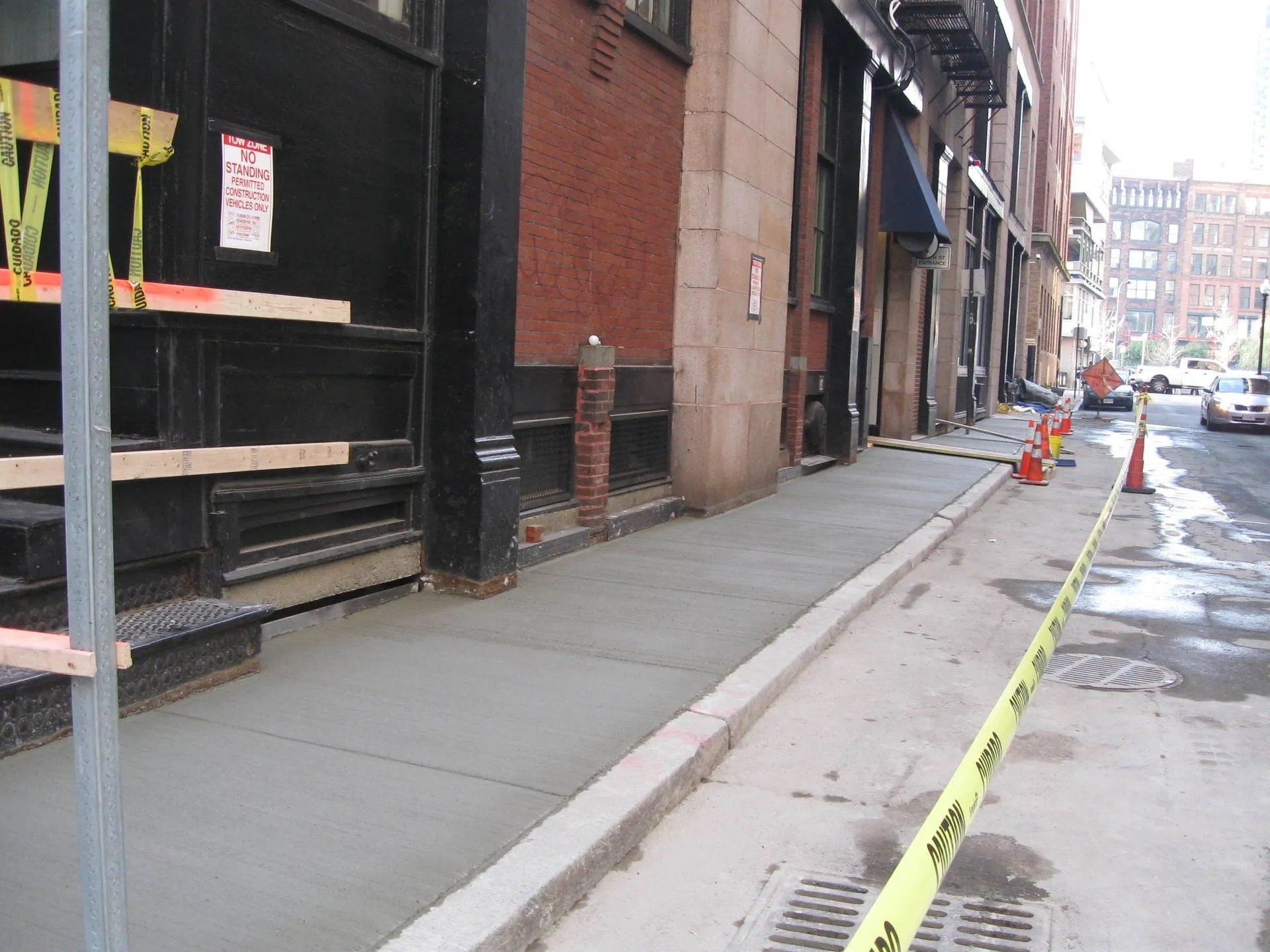 New concrete sidewalk on a commercial building